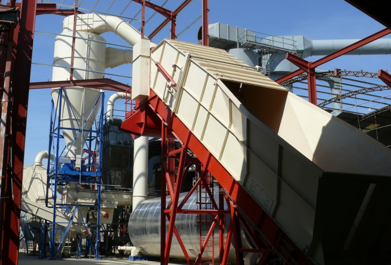 The processing of alfalfa into pellets or bales